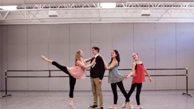 contemporary dancers pose in studio